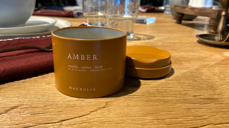 Magnolia Amber Candle on table