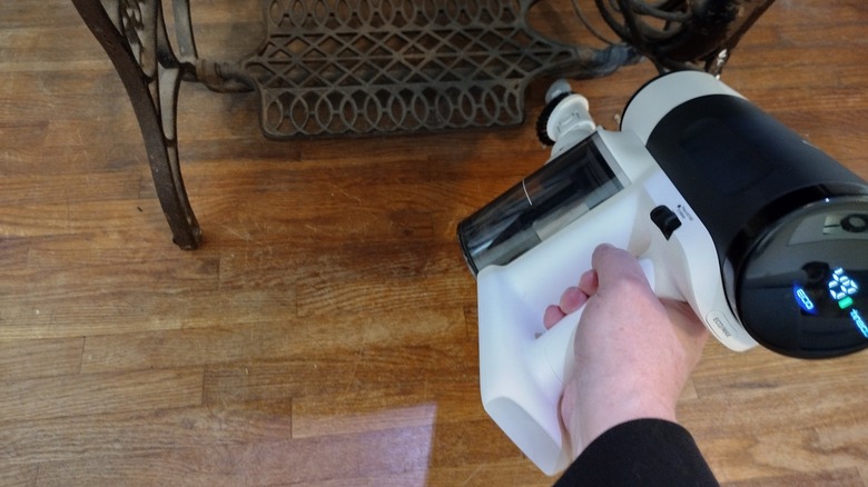 vacuuming under furniture