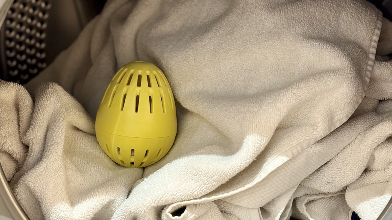 Laundry egg atop white towels