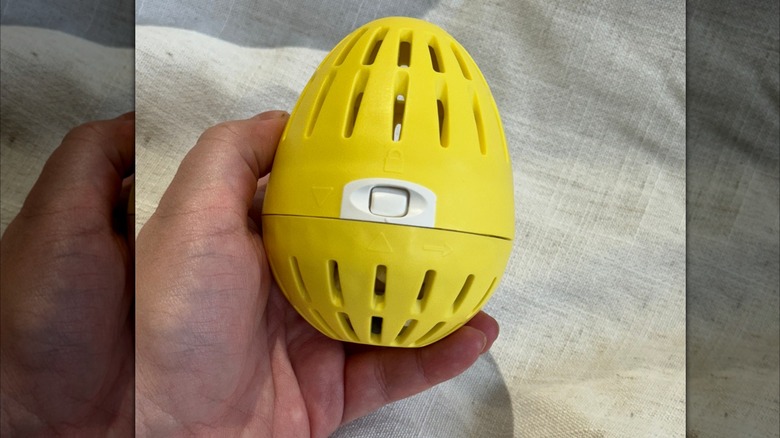 Yellow laundry egg locking mechanism 