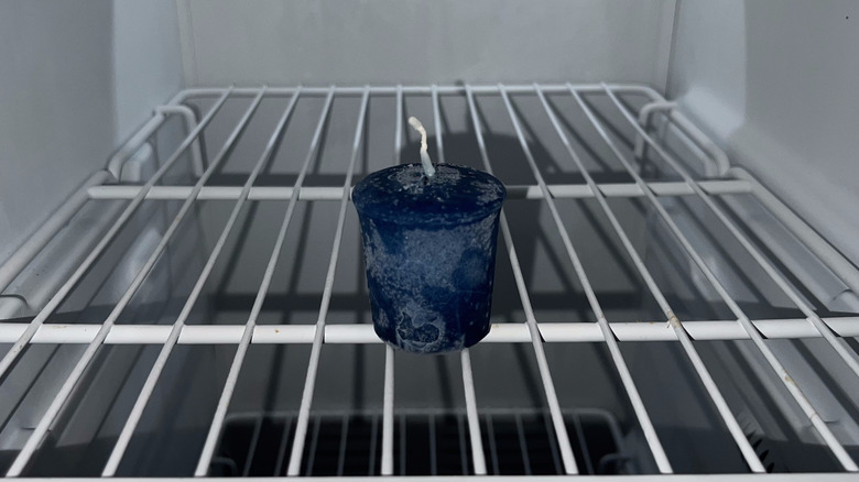 blue candle in freezer