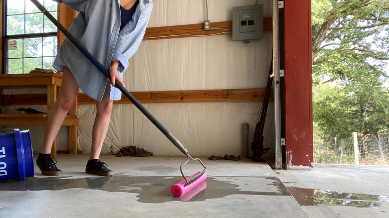 Person pushing water out of garage