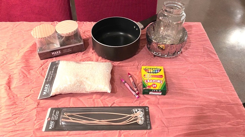 Candle crafting supplies on table