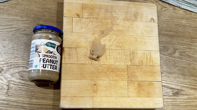 Peanut butter and cutting board