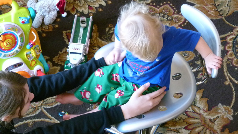 Child spinning in desk chair