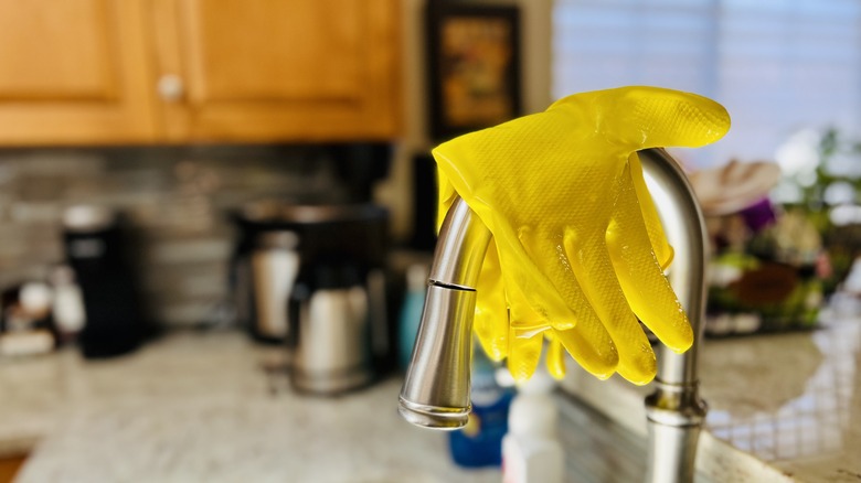 gloves over sink faucet