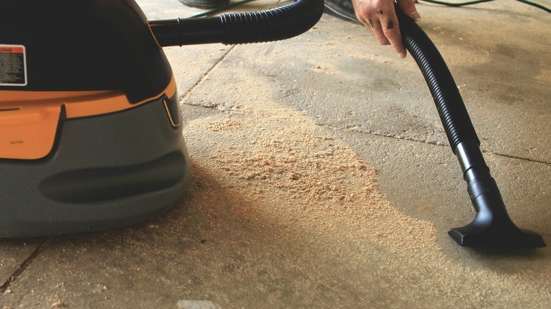 Vacuuming up dust 