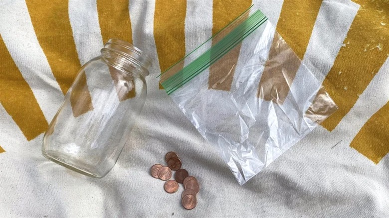 Jar, plastic bag, and pennies