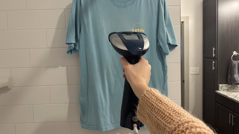 person steaming blue t-shirt