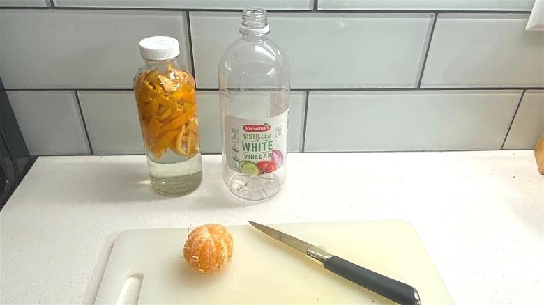 orange peels, vinegar, bottles