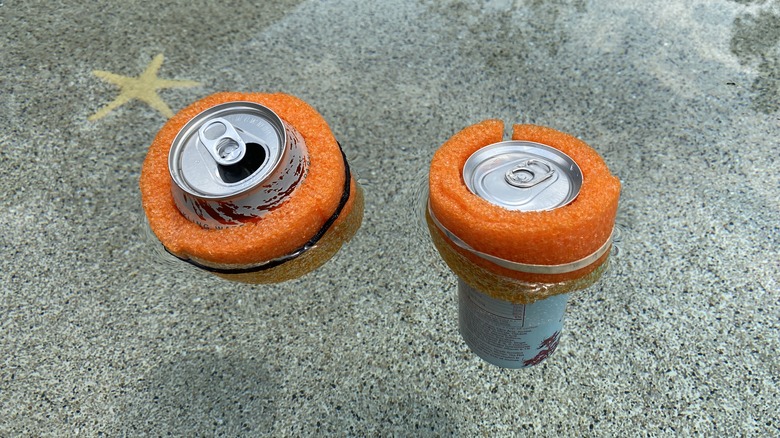 Canned drinks floating in water