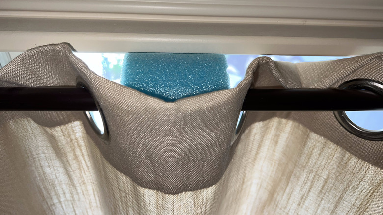 pool noodle on curtain rod