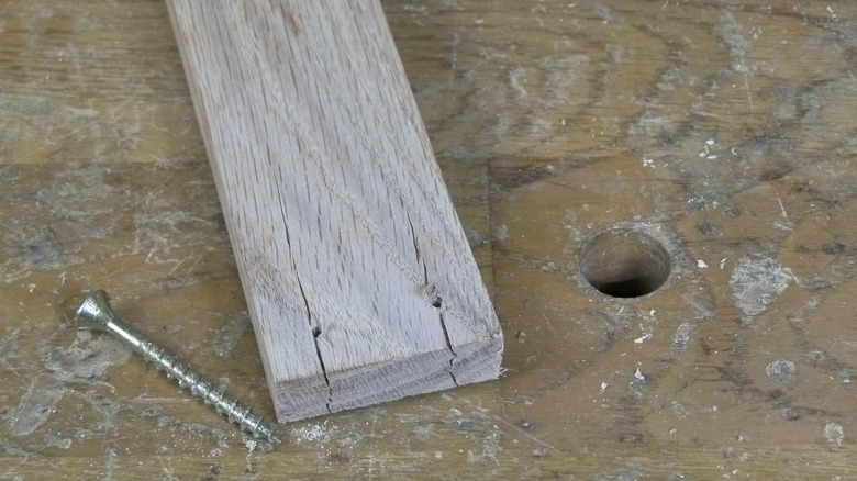 Split oak board and screw