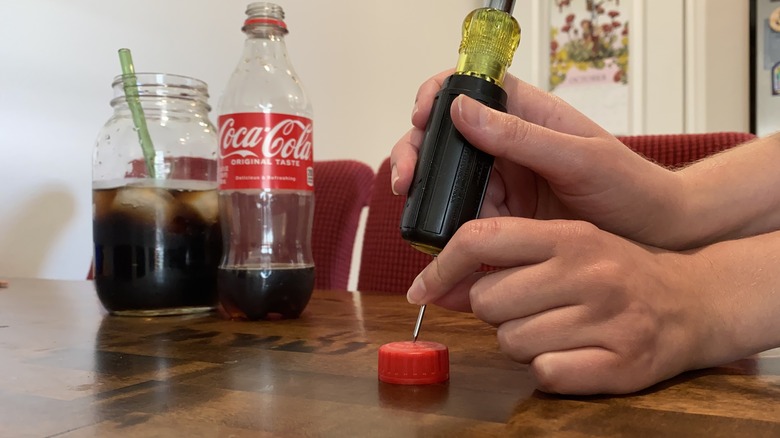 Poking hole into bottle cap