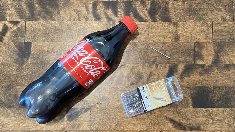 Coke bottle and nails