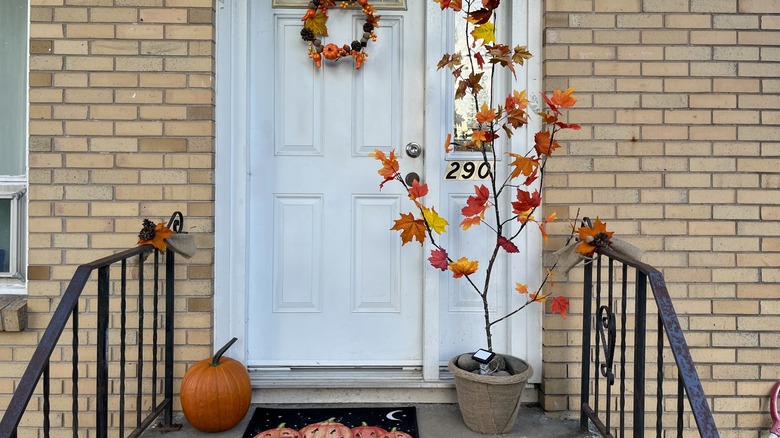 Front porch decorated for fall