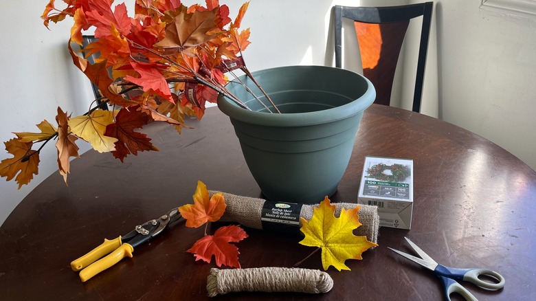 Green planter with craft supplies