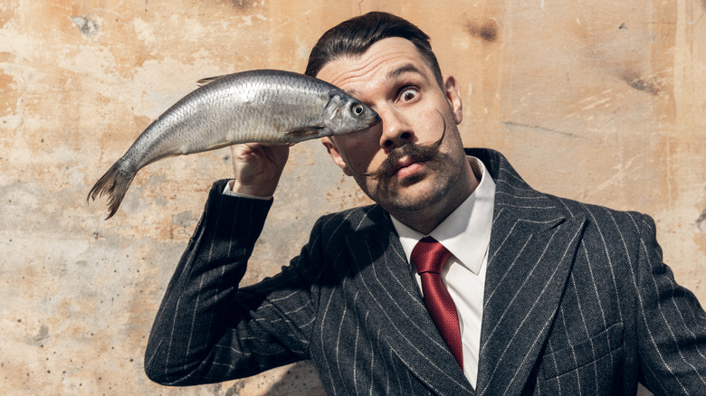 Man with fish for eye