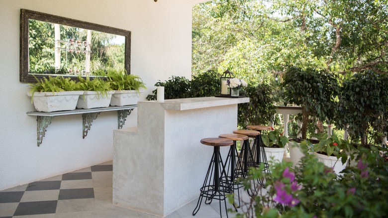 Outdoor bar with bar stools