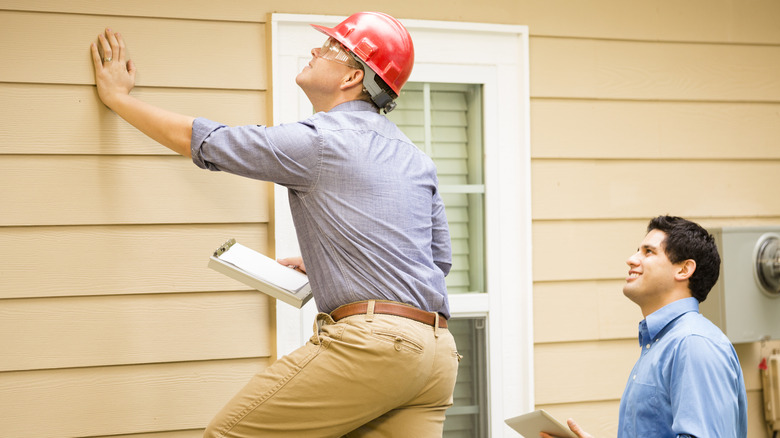 Home inspector looking at home