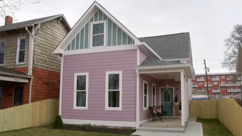 house with pink and green siding