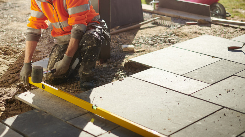 Man installing paved patio