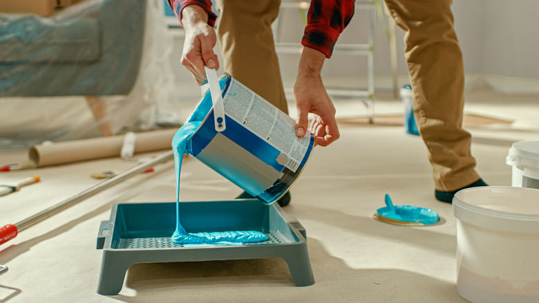 pouring paint into pan