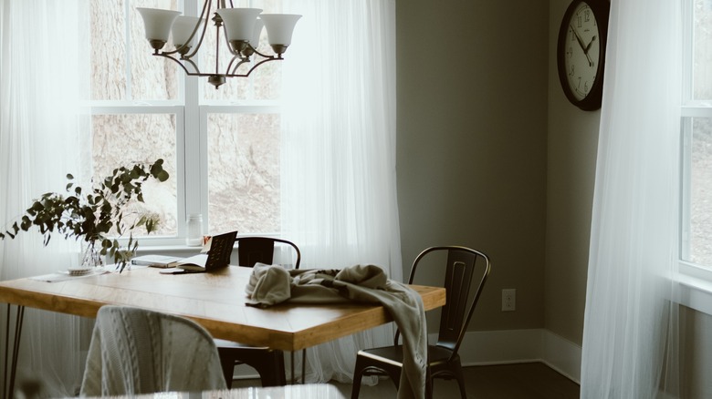 metal chairs around wooden table