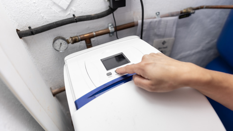 Hand programs water softener