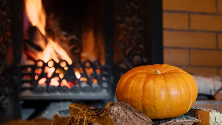 Wood fireplace and seasonal pumpkin
