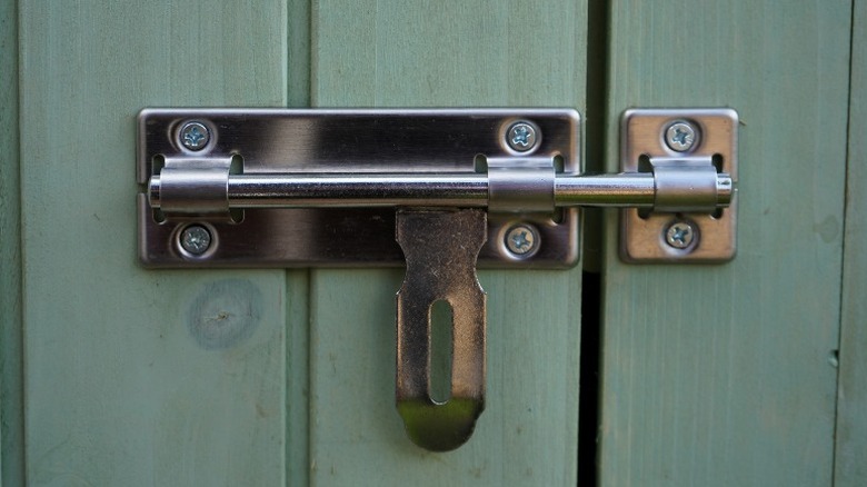 Chrome bolt on green gate