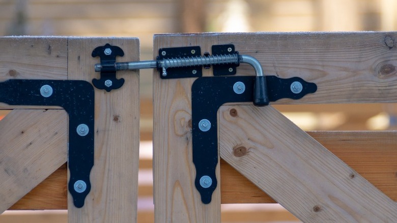 Spring latch on wooden gates