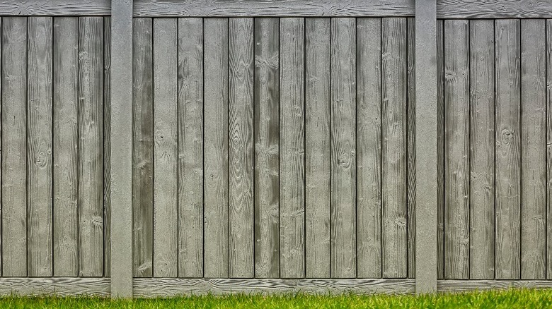 Gray composite wood vertical fence