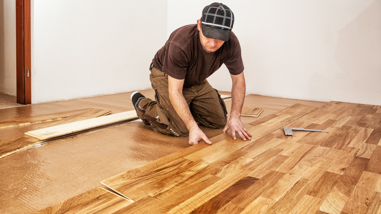 DIYer installing flooring