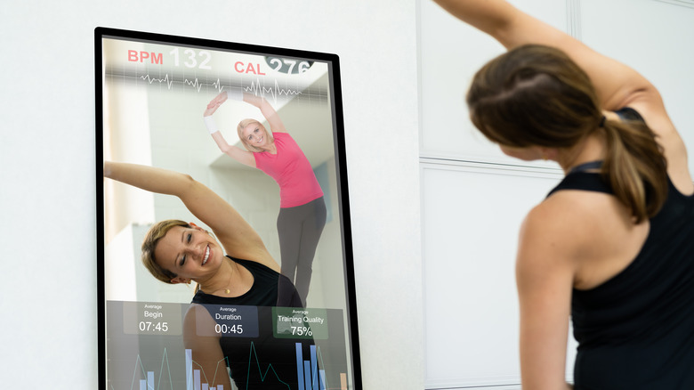 woman doing workout in mirror