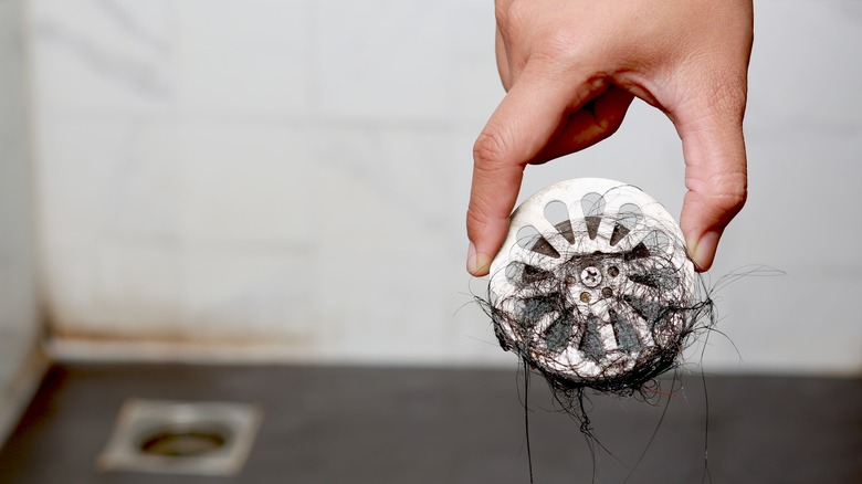 Throwing toilet paper into toilet bowl