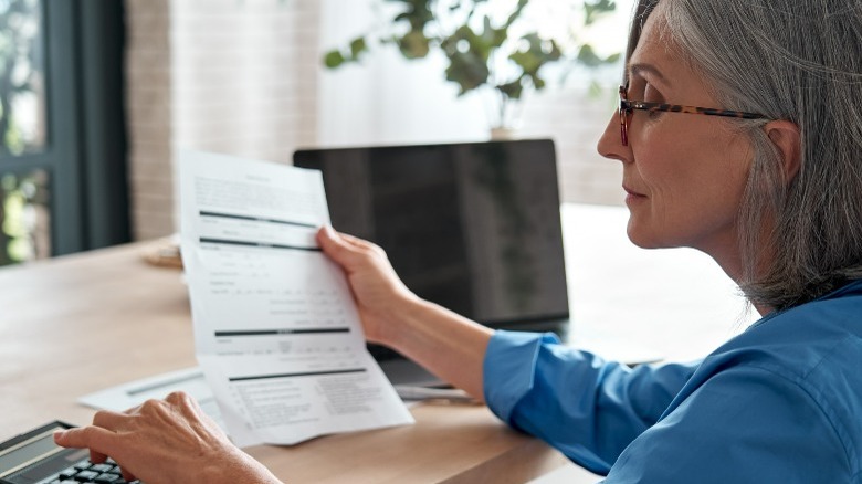 A woman using a calculator