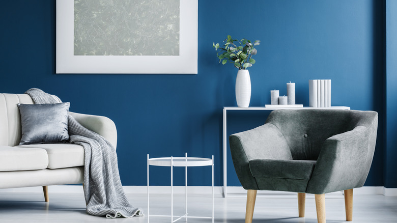 grey furniture in a blue room