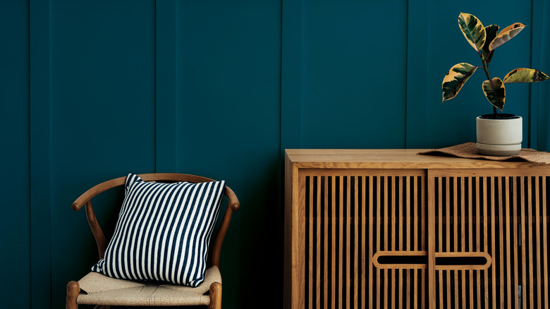 wooden furniture in a blue room