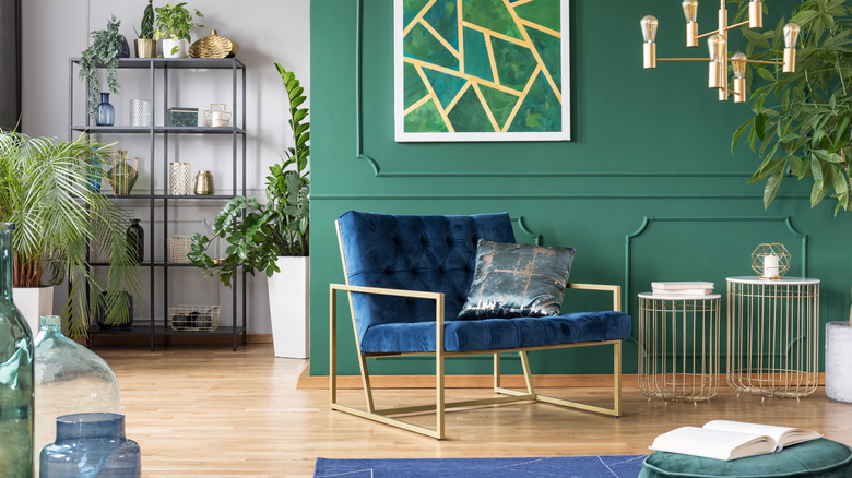 blue furniture in a green room