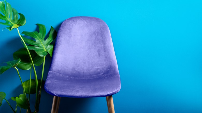 purple chair in a blue room
