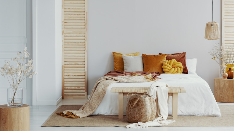 Orange, yellow, and oak bedroom