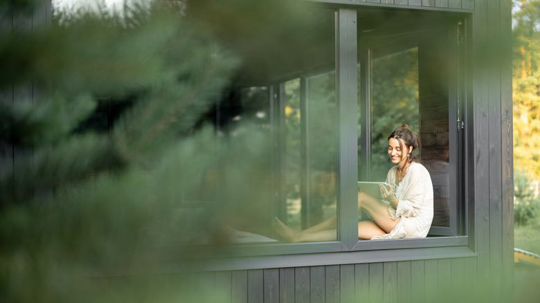 woman sitting in window