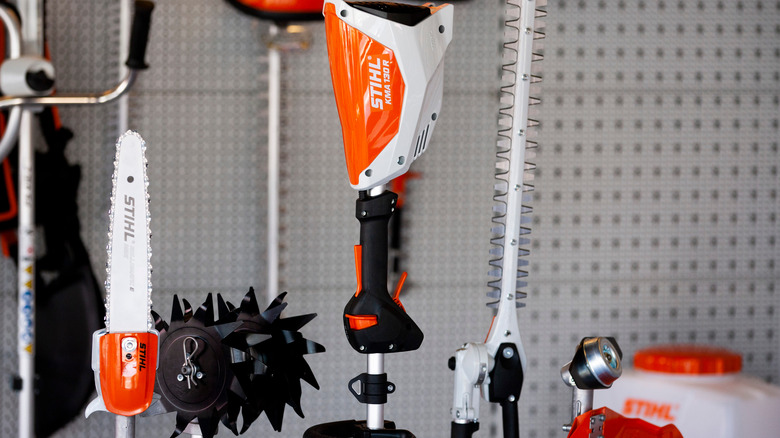 Stihl outdoor power tools hanging on a wall