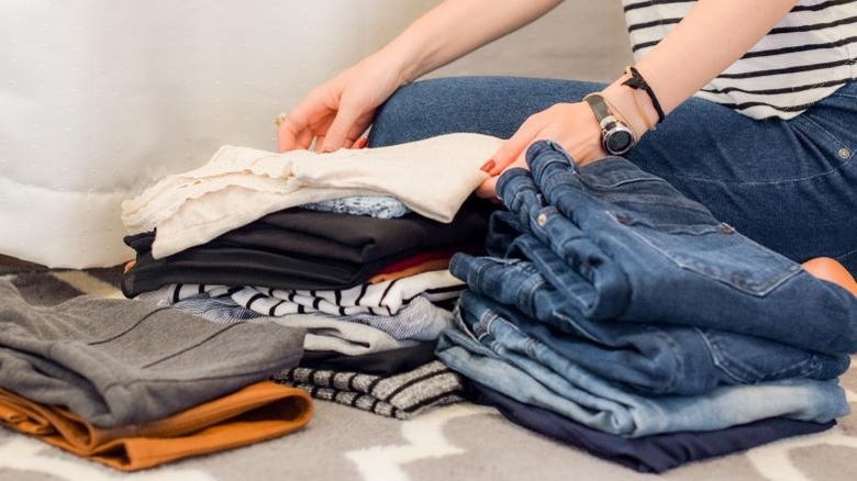 Person folding laundry