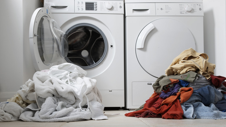 Woman in red shirt sorting laundry