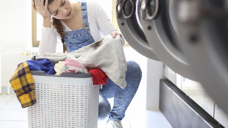 Woman notices stain on white clothing