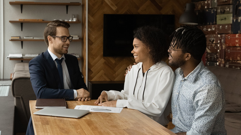 couple sitting with advisor