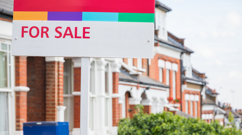 for sale sign terraced street