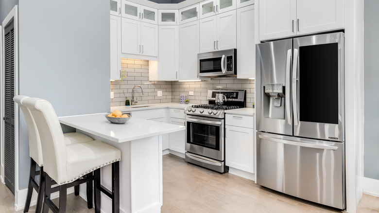 A stainless steel fridge with an ice maker